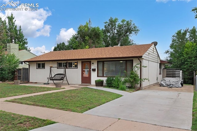 ranch-style home featuring a front yard