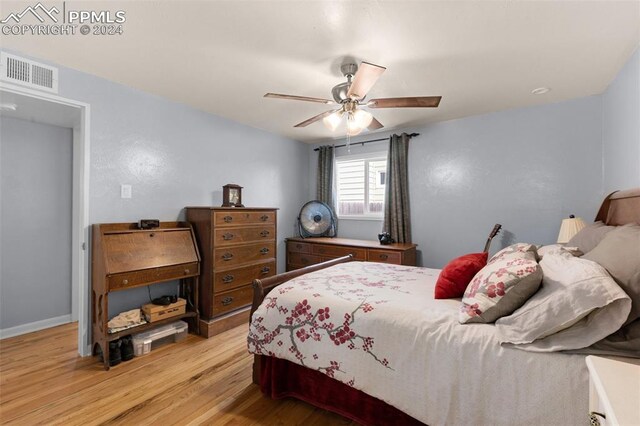 bedroom featuring ceiling fan and light hardwood / wood-style floors