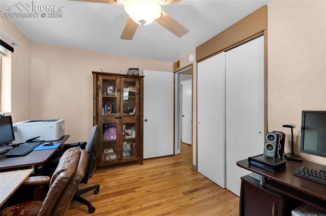 office area with ceiling fan and light hardwood / wood-style floors