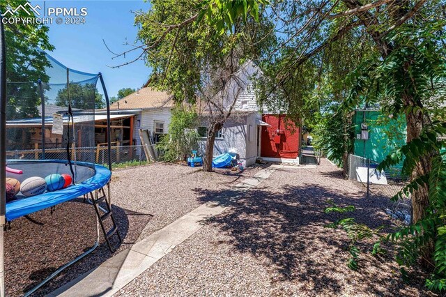 view of yard with a trampoline