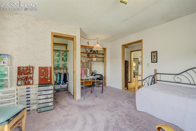 carpeted bedroom with a textured ceiling