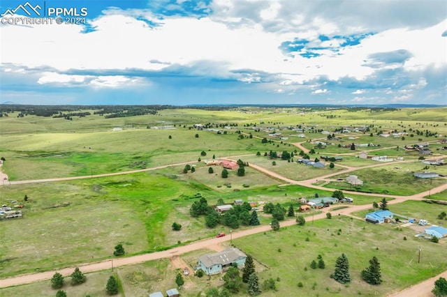 birds eye view of property featuring a rural view