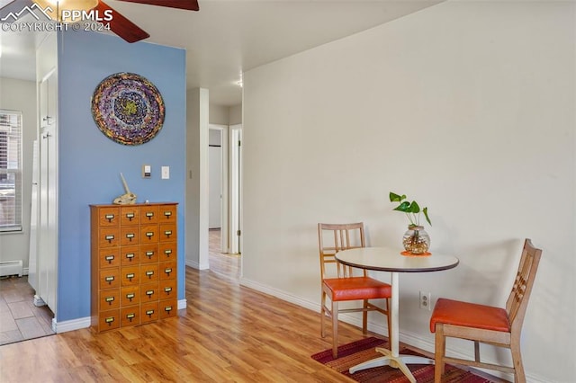 dining room with light wood-type flooring and ceiling fan