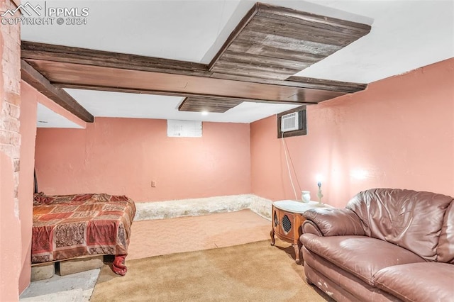 bedroom with light colored carpet and an AC wall unit