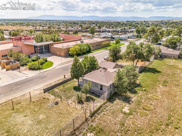 birds eye view of property with a mountain view