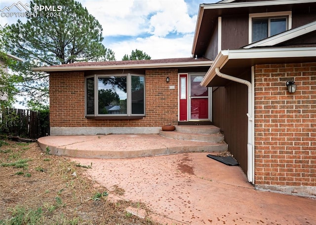 doorway to property featuring a patio area