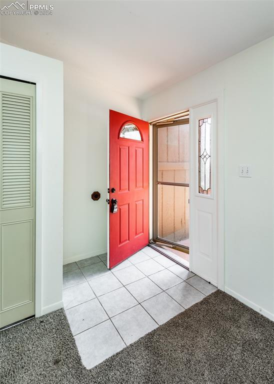 foyer featuring light tile patterned floors