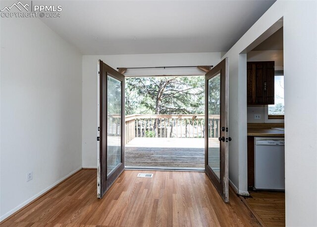 entryway with hardwood / wood-style floors