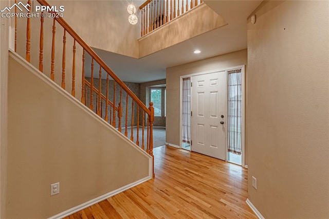 foyer entrance with light hardwood / wood-style flooring