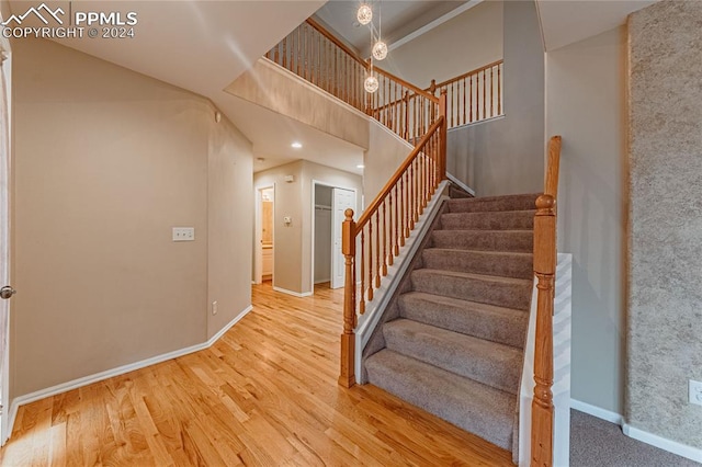 stairway featuring hardwood / wood-style floors