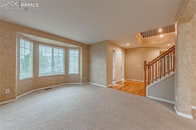 spare room featuring light hardwood / wood-style floors