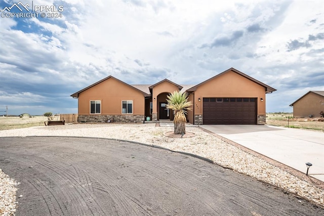 single story home featuring a garage