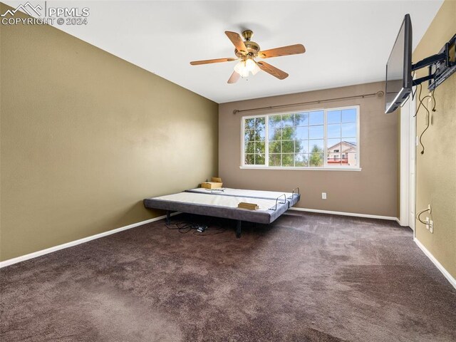 unfurnished bedroom featuring ceiling fan and carpet flooring