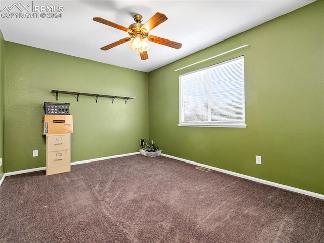 unfurnished bedroom featuring ceiling fan and carpet floors