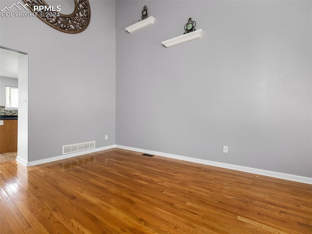 unfurnished room featuring wood-type flooring