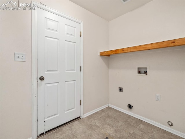 laundry room featuring light tile patterned floors, washer hookup, and electric dryer hookup