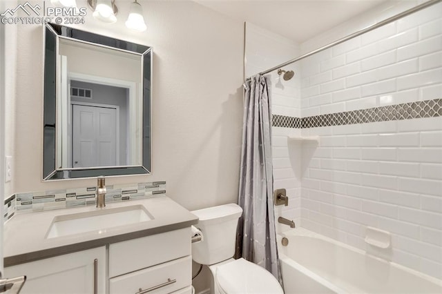 full bathroom with backsplash, toilet, vanity, and shower / bath combo