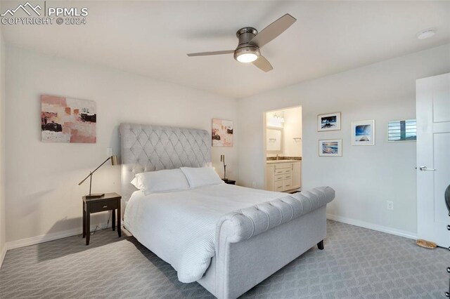 carpeted bedroom featuring ceiling fan and ensuite bathroom