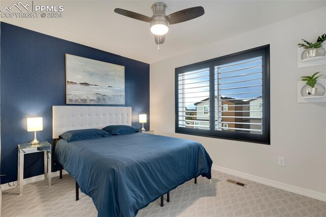 carpeted bedroom with ceiling fan