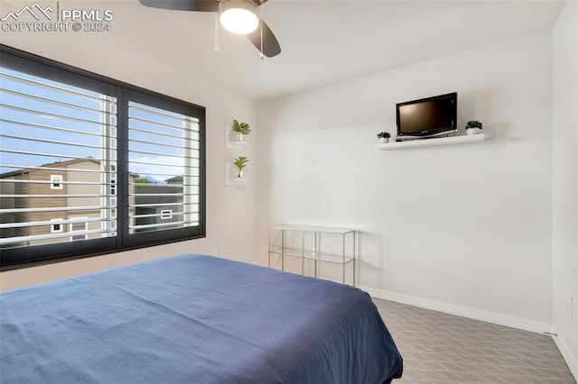 carpeted bedroom featuring ceiling fan