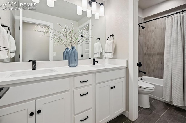 full bathroom featuring vanity, tile patterned floors, toilet, and shower / bath combo