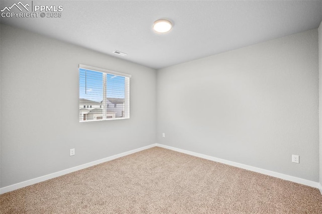 view of carpeted spare room