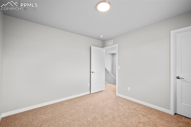 unfurnished bedroom featuring carpet