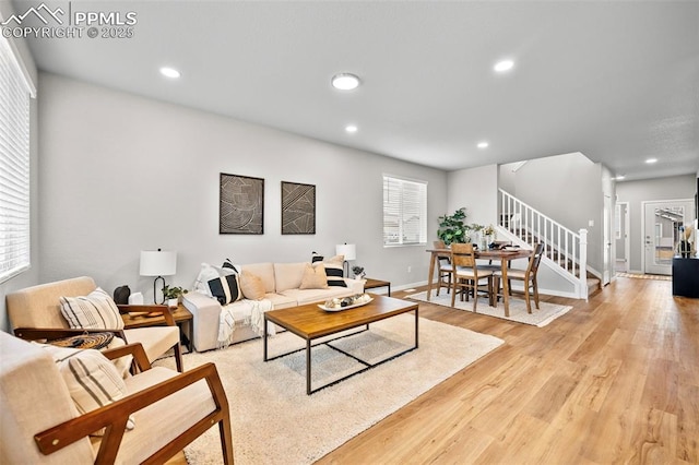 living room with light hardwood / wood-style flooring