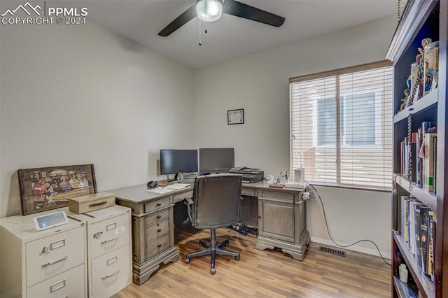 office area with light wood-type flooring and ceiling fan