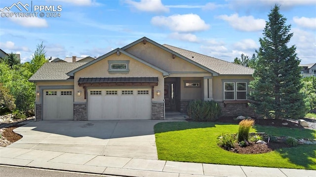 craftsman inspired home featuring a garage, driveway, stone siding, stucco siding, and a front yard