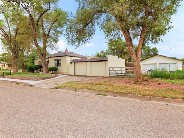 view of front of home with an outbuilding and a garage