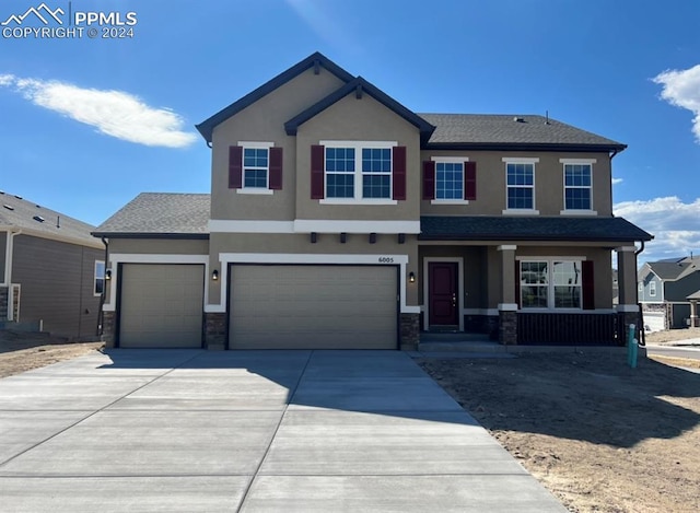 view of front of property with a garage