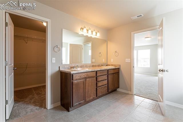 bathroom featuring vanity and tile patterned flooring