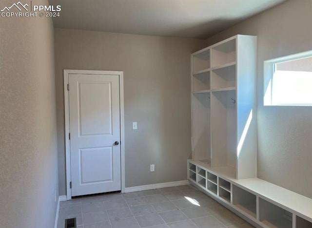 mudroom featuring light tile patterned floors