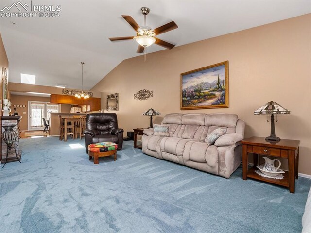 carpeted living room featuring ceiling fan and lofted ceiling