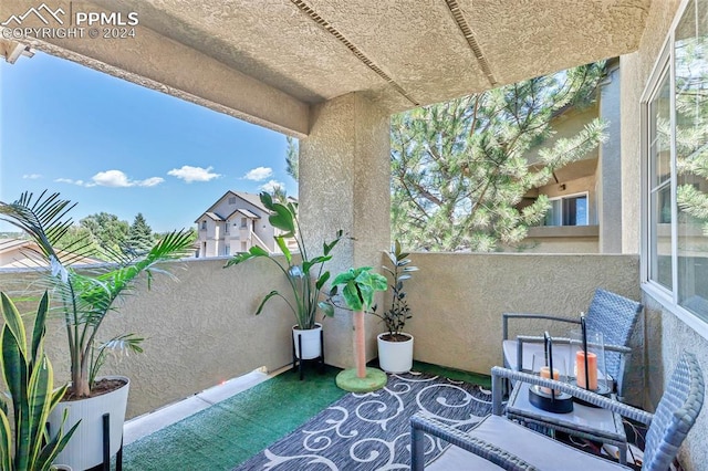 view of patio with a balcony