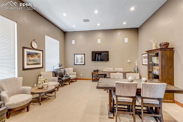 dining space with light colored carpet