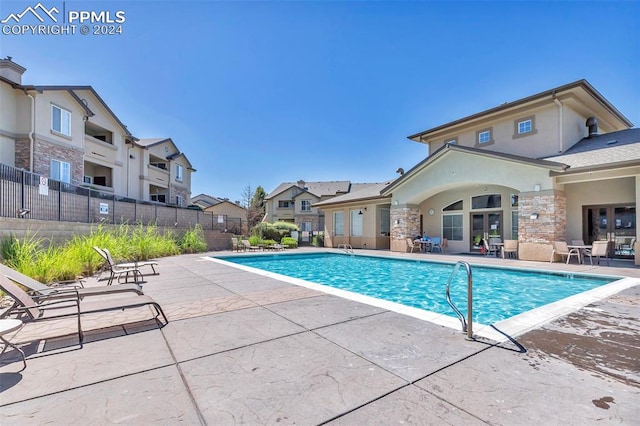 view of swimming pool featuring a patio