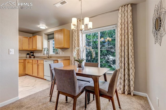 carpeted dining area with sink and an inviting chandelier