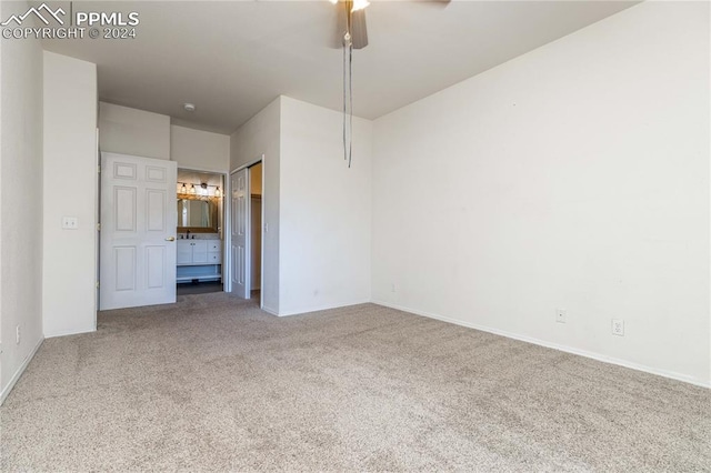 carpeted empty room with baseboards