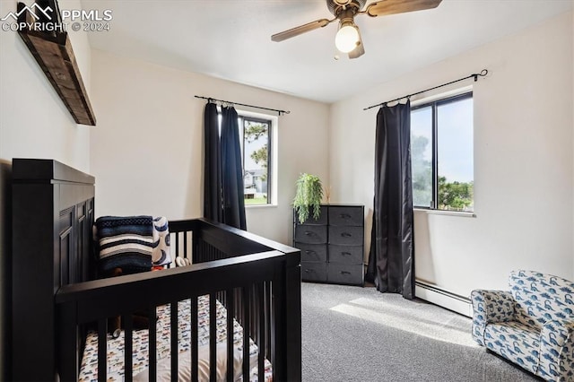 bedroom featuring a baseboard radiator, ceiling fan, and carpet floors