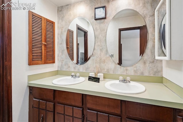 bathroom featuring dual vanity