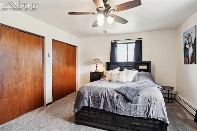 bedroom featuring ceiling fan, two closets, and carpet