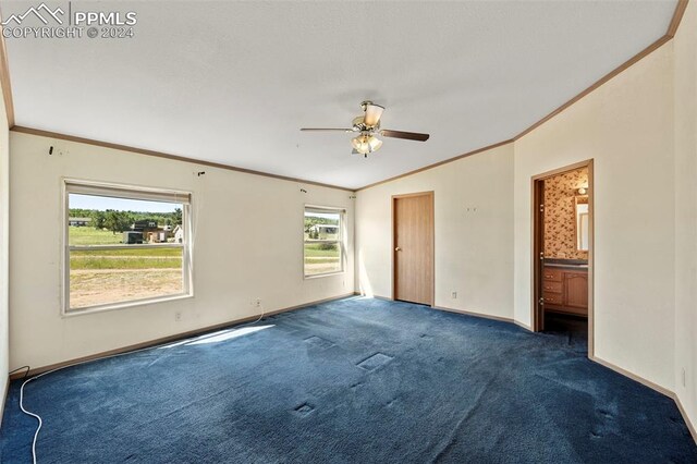 unfurnished bedroom with ceiling fan, vaulted ceiling, carpet floors, and ornamental molding