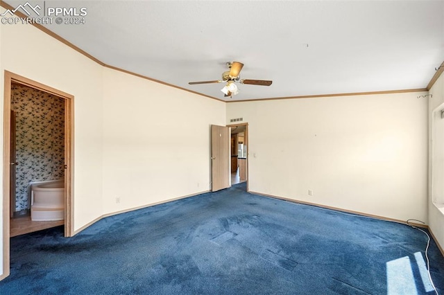 carpeted empty room with ceiling fan, ornamental molding, visible vents, and baseboards