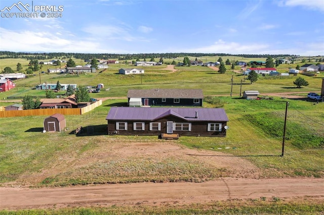 birds eye view of property with a rural view