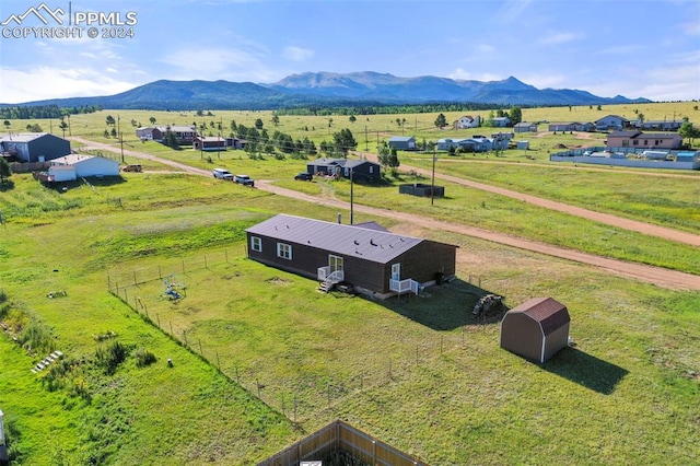 drone / aerial view with a rural view and a mountain view