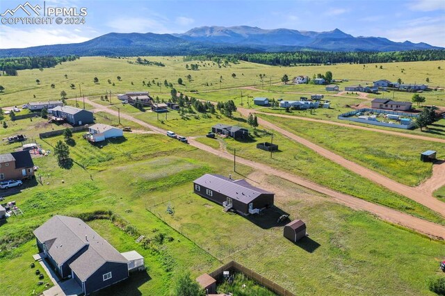 aerial view with a mountain view and a rural view