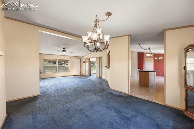 unfurnished room featuring dark carpet, baseboards, and ceiling fan with notable chandelier