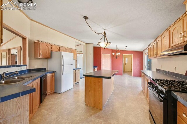 kitchen with sink, gas stove, a kitchen island, light tile patterned flooring, and white refrigerator